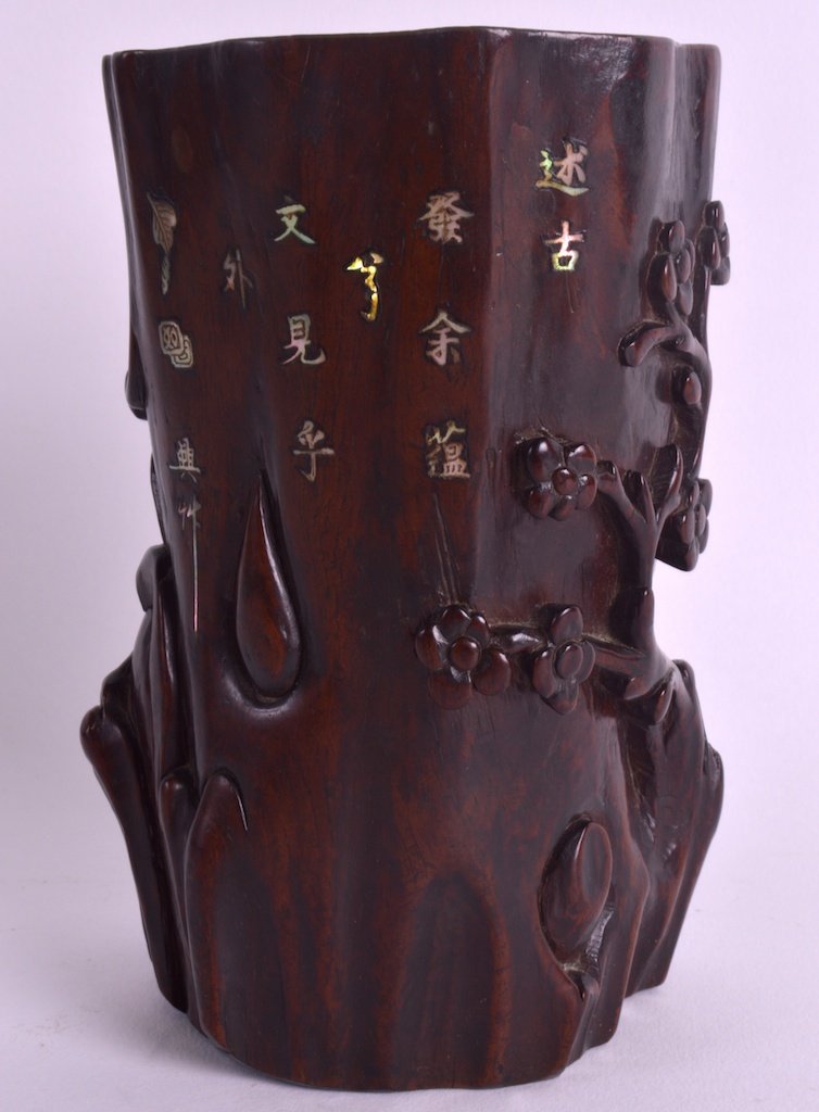 A 19TH CENTURY CHINESE CARVED HARDWOOD BRUSH POT: A 19TH CENTURY CHINESE CARVED HARDWOOD BRUSH POT bearing Chenghua marks to base, inset with mother of pearl calligraphy. 5.75ins high.