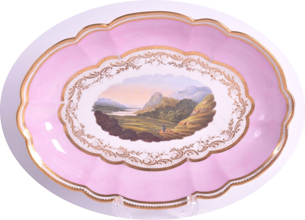 AN EARLY 19TH CENTURY BARR FLIGHT AN BARR WORCESTER: AN EARLY 19TH CENTURY BARR FLIGHT AN BARR WORCESTER OVAL DISH painted with a scene ‘Vale of Ffestiniog Denbighshire’ upon a pink ground. 11ins wide.