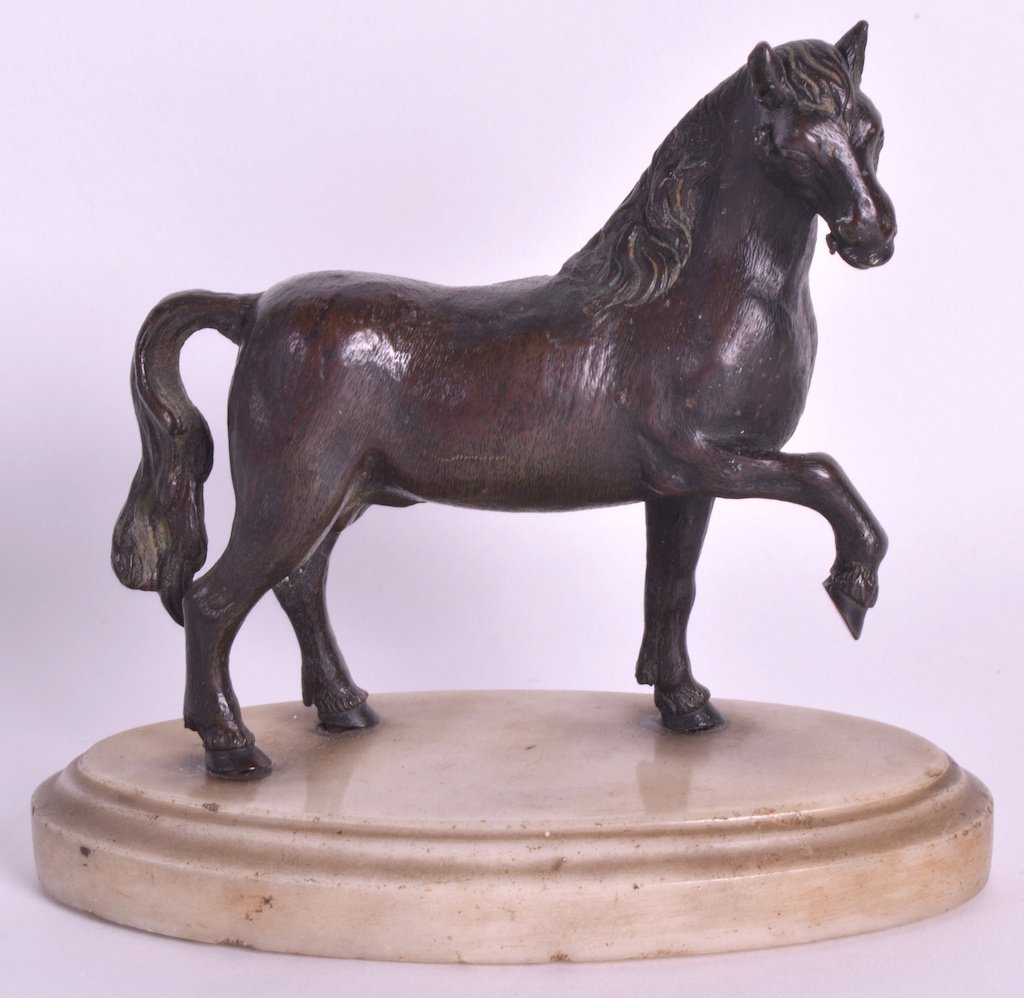 MANNER OF BARTHELEMY PRIEUR (1536-1611) AN 18TH/19TH: MANNER OF BARTHELEMY PRIEUR (1536-1611) AN 18TH/19TH CENTURY ITALIAN BRONZE MODEL OF A RENAISSANCE HORSE modelled in a roaming stance upon a marble base. Bronze 5ins wide. £300-500 .