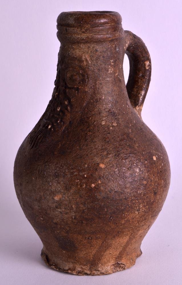 A 17TH CENTURY GERMAN STONEWARE BELLARMINE JUG with (1 of 1)