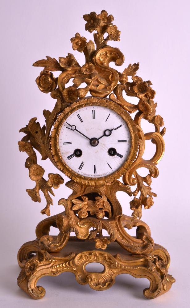 A LATE 19TH CENTURY ORMOLU MANTEL CLOCK with white (1 of 5)