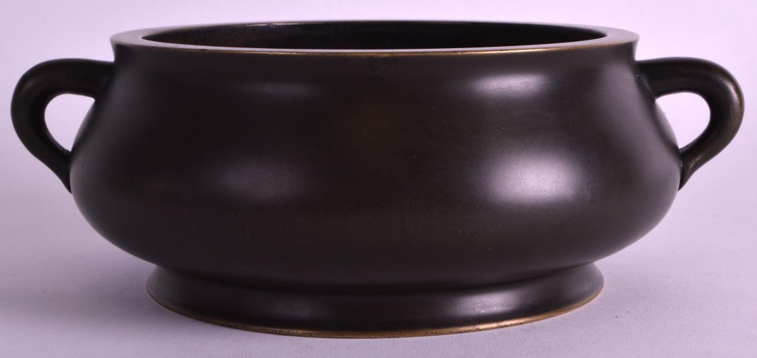A CHINESE QING DYNASTY TWIN HANDLED BRONZE CENSER (1 of 6)
