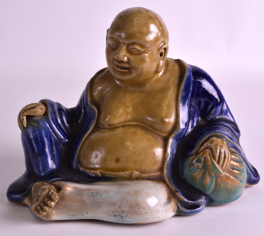 A 19TH CENTURY CHINESE POTTERY FIGURE OF A BUDDHA (1 of 3)