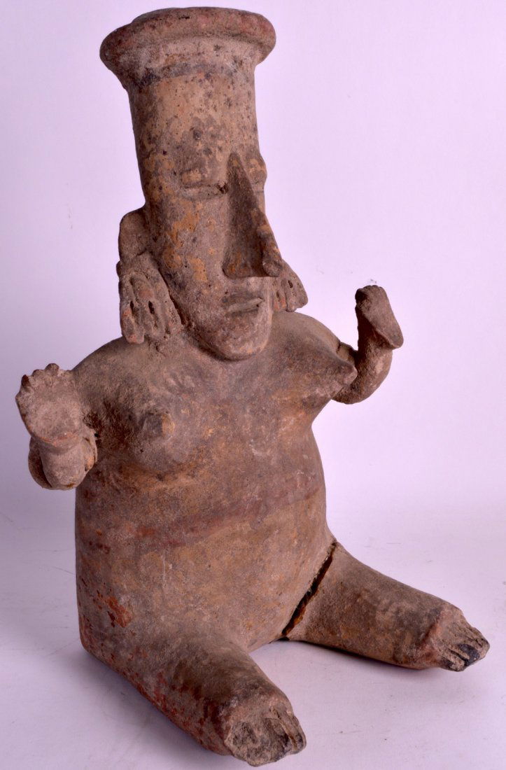 A PRE COLUMBIAN POTTERY FIGURE OF A FEMALE modelled (1 of 1)