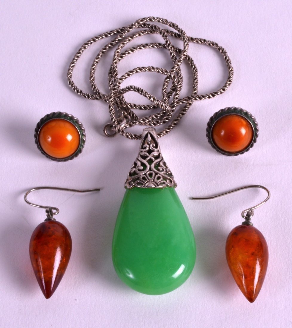 A CHINESE SILVER MOUNTED JADEITE PENDANT 20th century, (1 of 1)