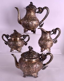 A FINE LATE 19TH CENTURY CHINESE EXPORT SILVER FOUR: A FINE LATE 19TH CENTURY CHINESE EXPORT SILVER FOUR PIECE TEASERVICE by Luenwo, decorated in relief with figures in various pursuits, within extensive landscapes. Coffee pot 9.5ins wide. 2190 grams. (