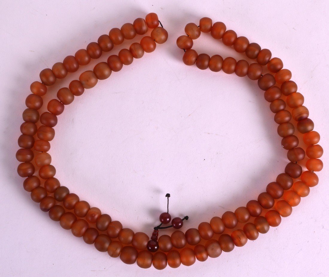 A CHINESE REPUBLICAN PERIOD CARVED ORANGE AGATE (1 of 2)