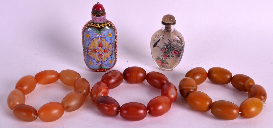A PAIR OF CHINESE CARVED AGATE BRACELETS 20th Century, (1 of 2)