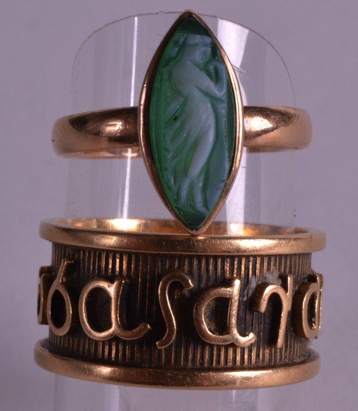 AN EDWARDIAN GOLD CAMEO RING together with a yellow: AN EDWARDIAN GOLD CAMEO RING together with a yellow metal band. (2)