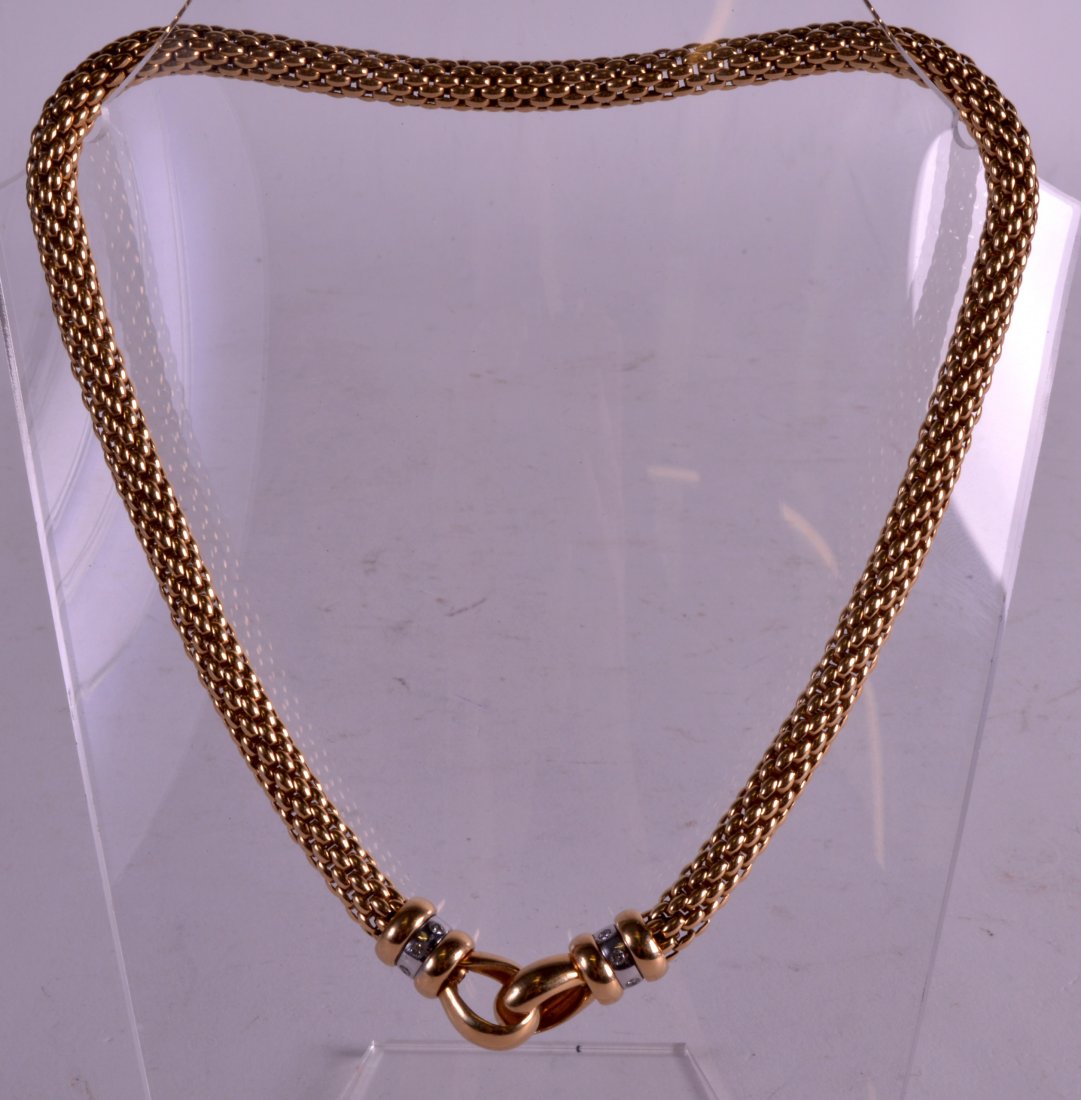 A FINE 18CT YELLOW GOLD LADIES CHOKER NECKLACE with: A FINE 18CT YELLOW GOLD LADIES CHOKER NECKLACE with inset white gold bands formed with diamonds. 63 grams. 15.5ins long overall.