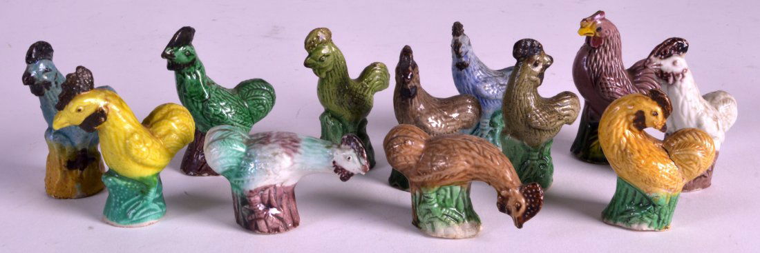 A SET OF TWELVE LATE 19TH CENTURY CHINESE SANCAI TYPE: A SET OF TWELVE LATE 19TH CENTURY CHINESE SANCAI TYPE GLAZED HENS each modelled upon a green glazed base. 2.75ins high.