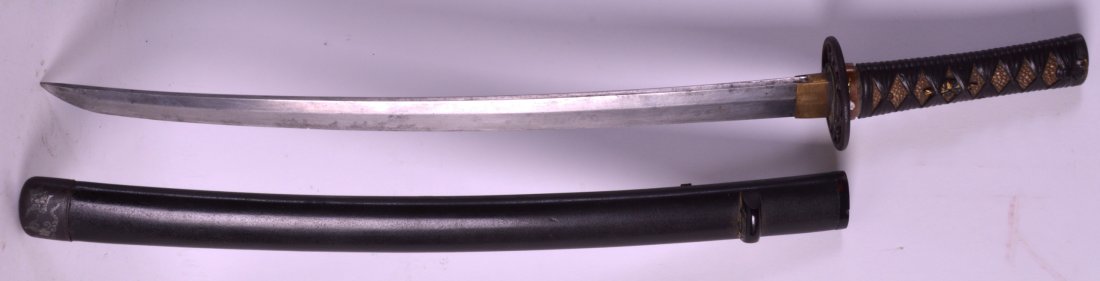 A GOOD 19TH CENTURY JAPANESE MEIJI PERIOD SWORD with: A GOOD 19TH CENTURY JAPANESE MEIJI PERIOD SWORD with shagreen handle overlaid with bronze foliage, the scabbard with speckled decoration. 2Ft long.