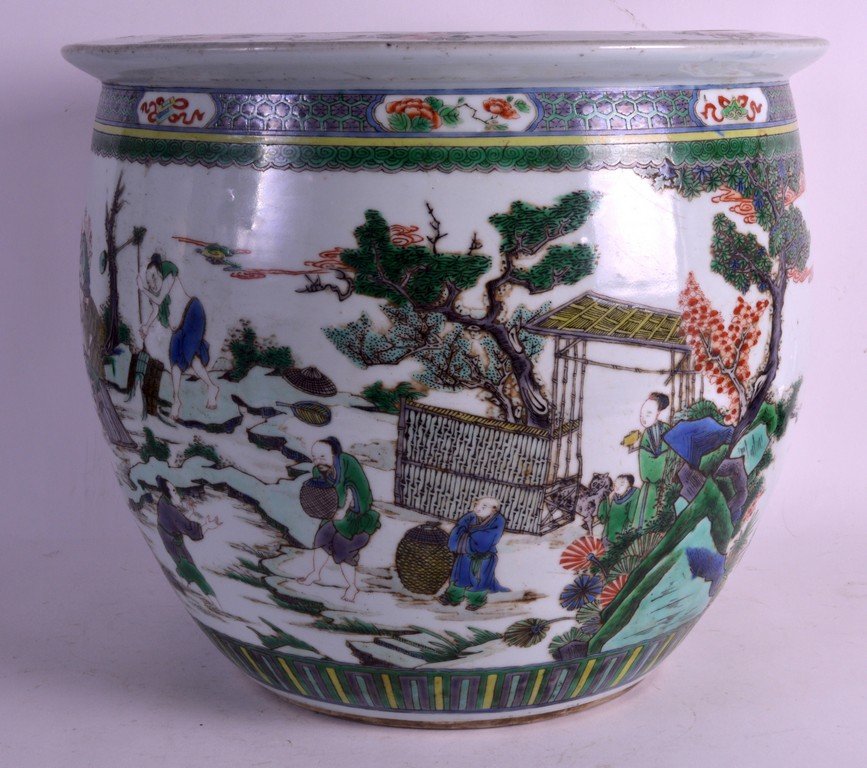 A GOOD MID 19TH CENTURY CHINESE FAMILLE VERTE: A GOOD MID 19TH CENTURY CHINESE FAMILLE VERTE JARDINIERE unusually painted with figures climbing a ladder and sitting within a tree. 1Ft 2ins diameter.