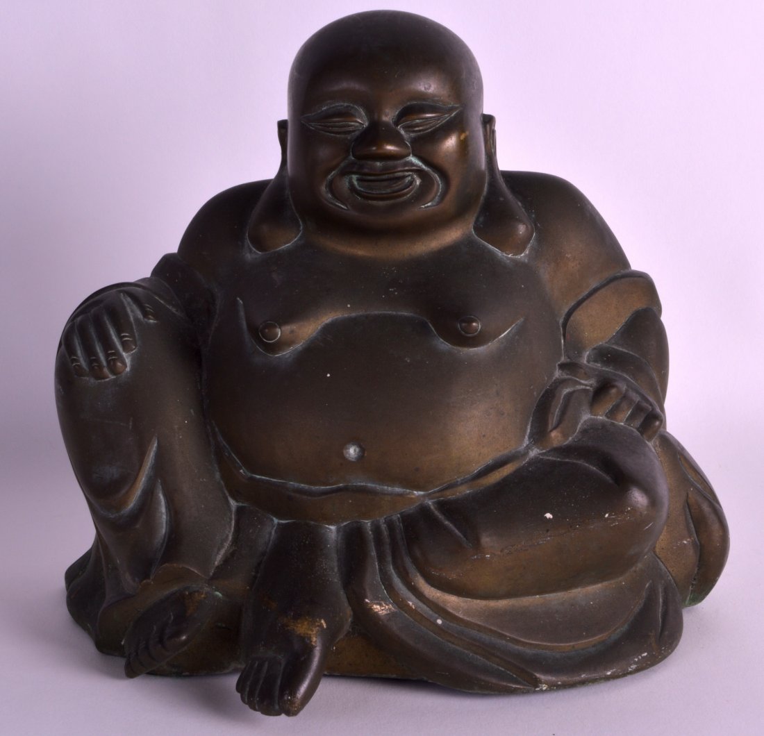 A LATE 19TH CENTURY CHINESE BRONZE FIGURE OF A BUDDHA: A LATE 19TH CENTURY CHINESE BRONZE FIGURE OF A BUDDHA modelled in robes. 8.5ins wide.