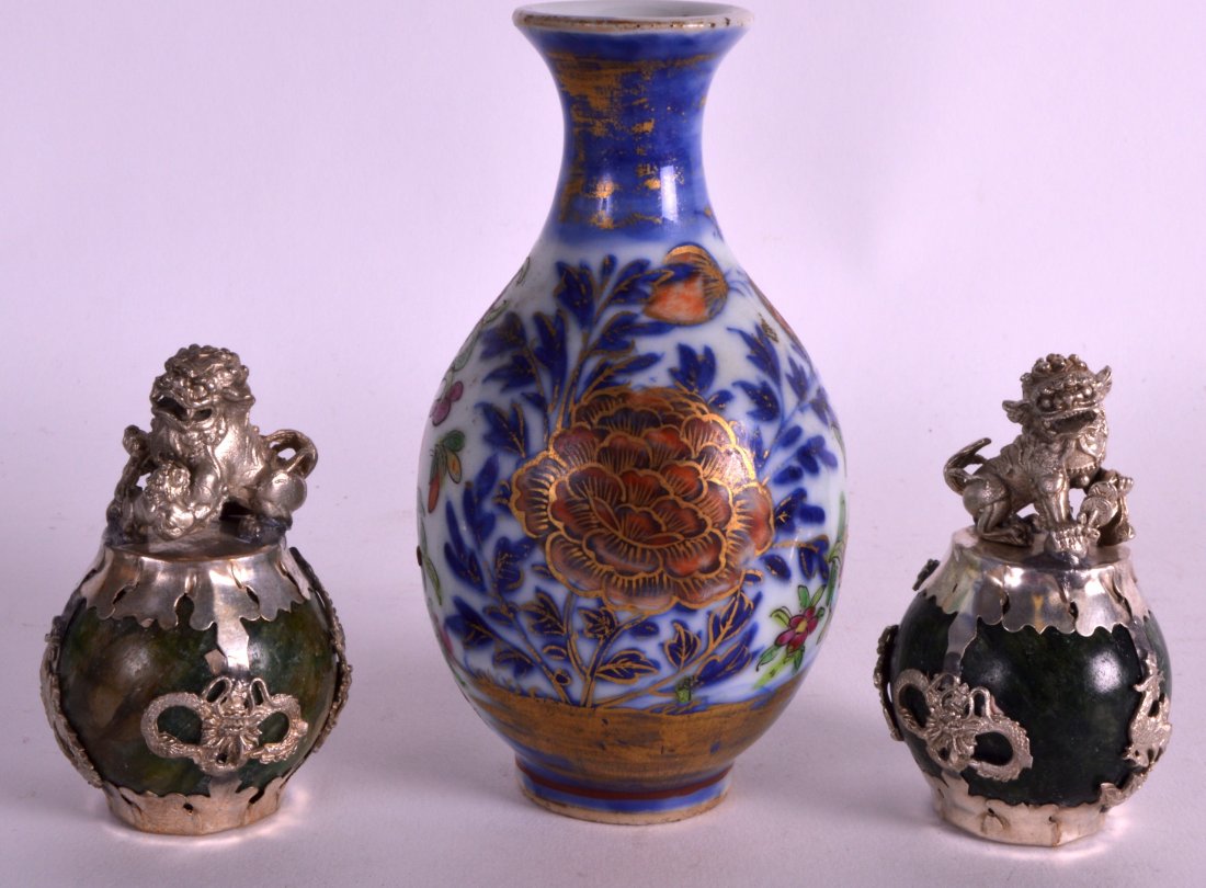 A 19TH CENTURY CHINESE CANTON FAMILLE ROSE VASE: A 19TH CENTURY CHINESE CANTON FAMILLE ROSE VASE together with a pair of white metal mounted hardstone eggs. (3)