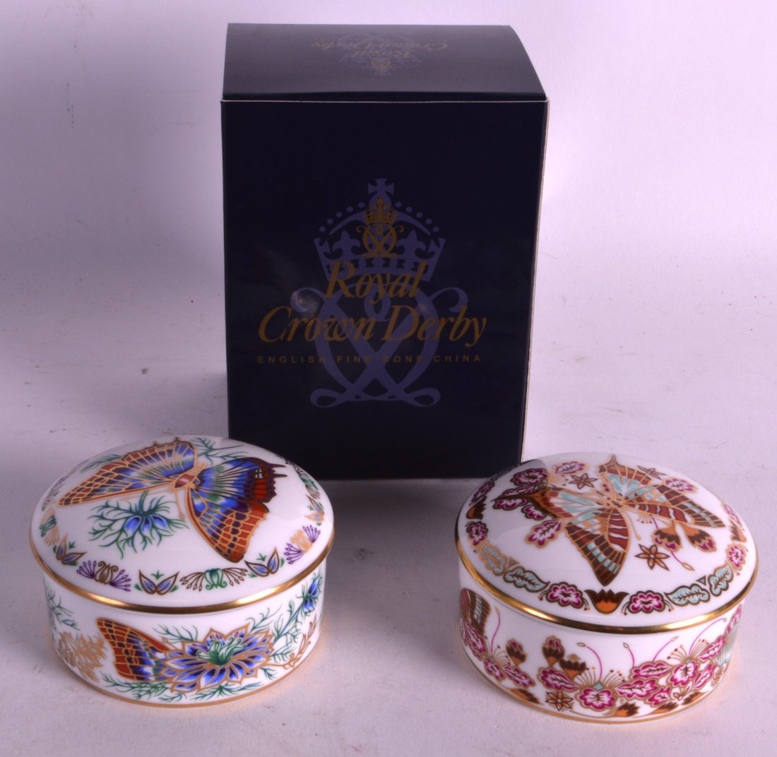TWO ROYAL CROWN DERBY TRINKET BOXES AND COVERS together: TWO ROYAL CROWN DERBY TRINKET BOXES AND COVERS together with a Santa Claus (box only). (3)