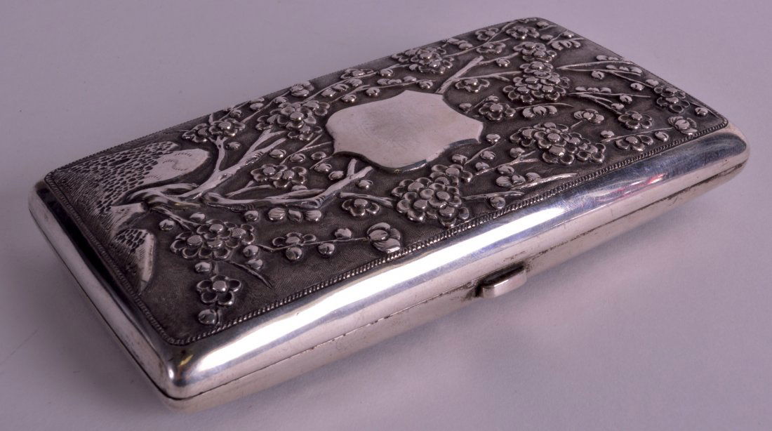 A LOVELY LATE 19TH CENTURY CHINESE EXPORT SILVER: A LOVELY LATE 19TH CENTURY CHINESE EXPORT SILVER CIGARETTE CASE by Luen Wo, decorated in relief with flowers and hollow rock. 158 grams. 4.75ins x 2.5ins.
