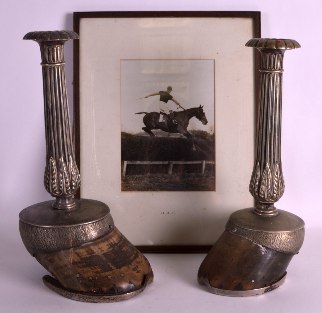 A GOOD PAIR OF LATE 19TH CENTURY SILVER PLATED: A GOOD PAIR OF LATE 19TH CENTURY SILVER PLATED CANDLESTICKS converted from horses hoofs, together with a photograph. 12.5ins high. (3)