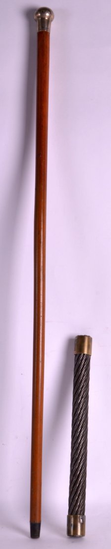 A LATE VICTORIAN SILVER TOPPED MALACCA WALKING CANE: A LATE VICTORIAN SILVER TOPPED MALACCA WALKING CANE together with a heavy British Rope LD baton. (2)