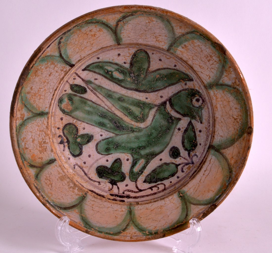AN EARLY POTTERY BOWL probably Byzantine period,: AN EARLY POTTERY BOWL probably Byzantine period, painted with a bird amongst foliage. 7.75ins diameter.