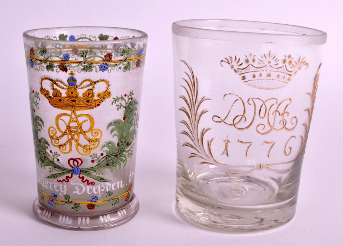 AN UNUSUAL 18TH CENTURY GERMAN ENAMELLED BEAKER dated: AN UNUSUAL 18TH CENTURY GERMAN ENAMELLED BEAKER dated 1710, together with another beaker engraved 1776. 3.75ins & 4ins high. (2)