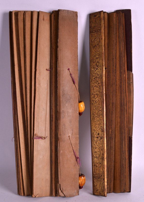 AN UNUSUAL EARLY 19TH CENTURY BURMESE BUDDHIST: AN UNUSUAL EARLY 19TH CENTURY BURMESE BUDDHIST MANUSCRIPT depicting pali script upon palm leaf pages, probably a prayer book.