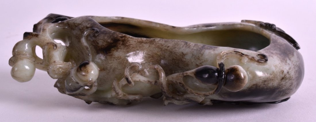 A CHINESE CARVED HARDSTONE BRUSH WASHER 20th Century,: A CHINESE CARVED HARDSTONE BRUSH WASHER 20th Century, of naturalistic form, modelled as an open gourd. 5.25ins wide.