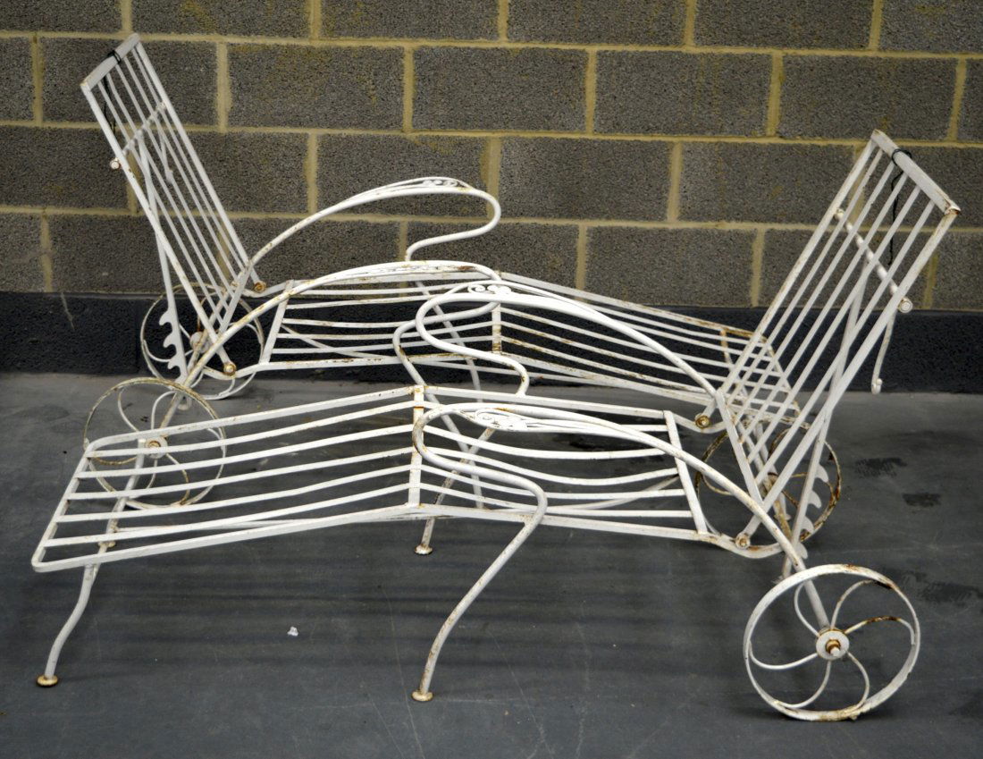 A PAIR OF EARLY 20TH CENTURY PAINTED IRON GARDEN: A PAIR OF EARLY 20TH CENTURY PAINTED IRON GARDEN RECLINERS.