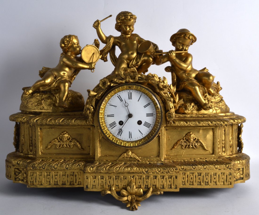 A LARGE 19TH CENTURY FRENCH GILT SPELTER MANTEL CLOCK: A LARGE 19TH CENTURY FRENCH GILT SPELTER MANTEL CLOCK modelled with three figures upon an acanthus capped base. 1Ft 9ins wide.
