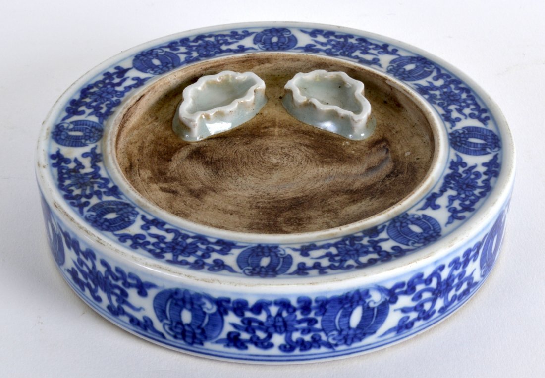 A CHINESE BLUE AND WHITE BRUSH WASHER 20th Century,: A CHINESE BLUE AND WHITE BRUSH WASHER 20th Century, bearing Daoguang marks to base, painted with flowers. 5.25ins diameter.