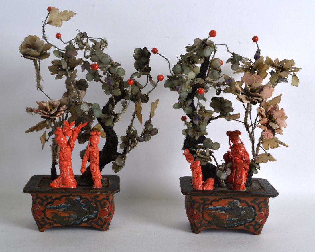 A RARE PAIR OF CHINESE QING DYNASTY CORAL AND LACQUER: A RARE PAIR OF CHINESE QING DYNASTY CORAL AND LACQUER BONZAI TREES each modelled with naturalistic sprigs formed with coral, jade and amethyst. 11Ins x 5ins.