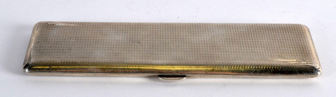 AN ART DECO ENGINE TURNED SILVER CIGARETTE CASE. (1 of 1)