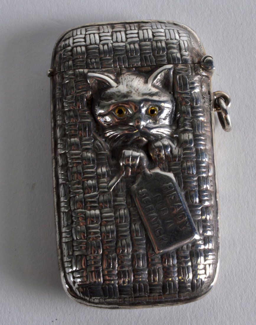 A NOVELTY SILVER CAT IN BASKET VESTA CASE. (1 of 1)