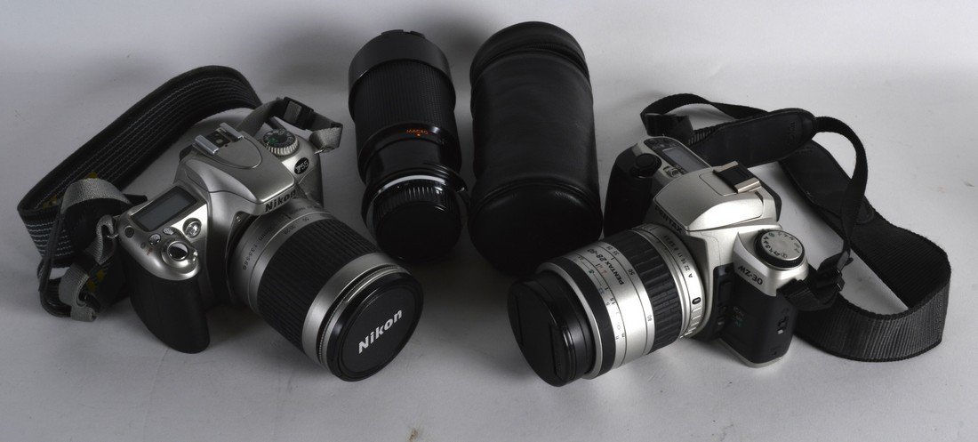 A NIKON CAMERA together with a pentax camera & a lens. (1 of 1)