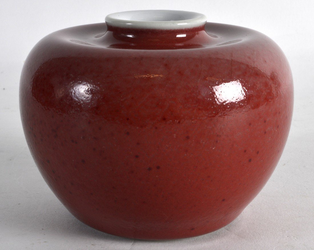 A CHINESE SANG DU BOEUF PORCELAIN BRUSH WASHER 20th: A CHINESE SANG DU BOEUF PORCELAIN BRUSH WASHER 20th Century, bearing Kangxi marks to base. 4.25ins diameter.