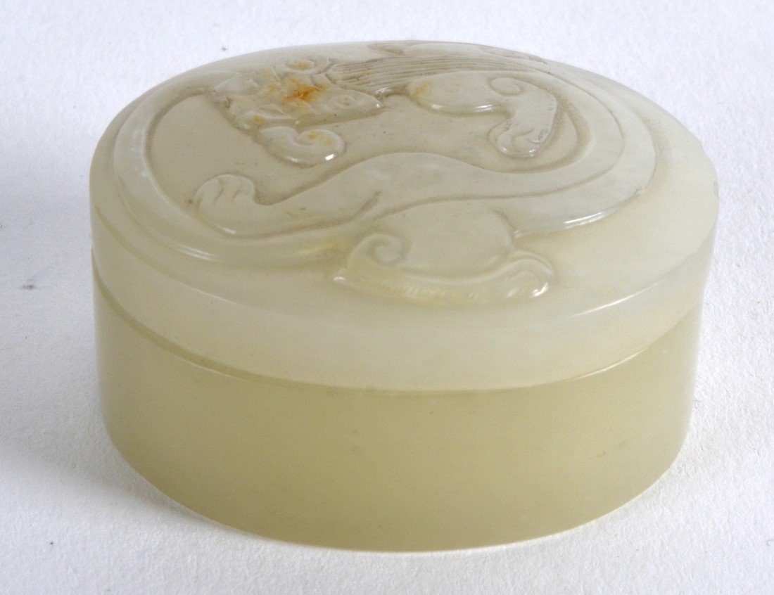 A SMALL CHINESE CARVED GREENISH WHITE JADE OVAL BOX AND (1 of 2)