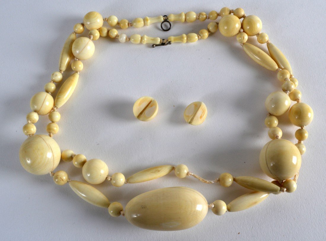 A LARGE 19TH/20TH CENTURY CARVED IVORY NECKLACE with (1 of 2)