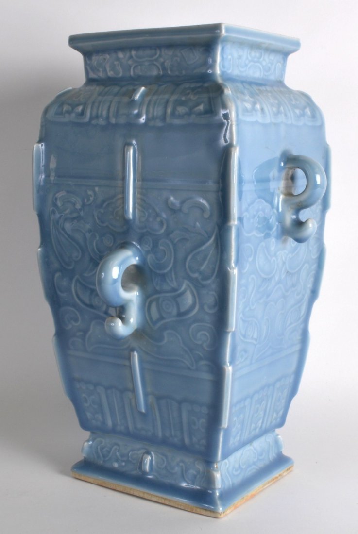 A LARGE CHINESE BLUE CELESTE ARCHAIC STYLE VASE bearing: A LARGE CHINESE BLUE CELESTE ARCHAIC STYLE VASE bearing Qianlong marks to base, decorated with taotie mask heads and vines. 1Ft 2.5ins high.