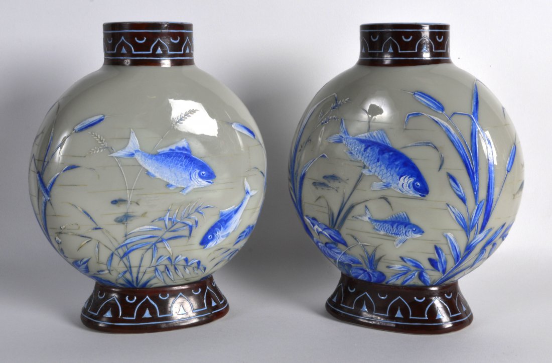 A PAIR OF LATE VICTORIAN OPALINE GLASS VASES painted: A PAIR OF LATE VICTORIAN OPALINE GLASS VASES painted with various fish swimming within a lake. 7.75ins high.