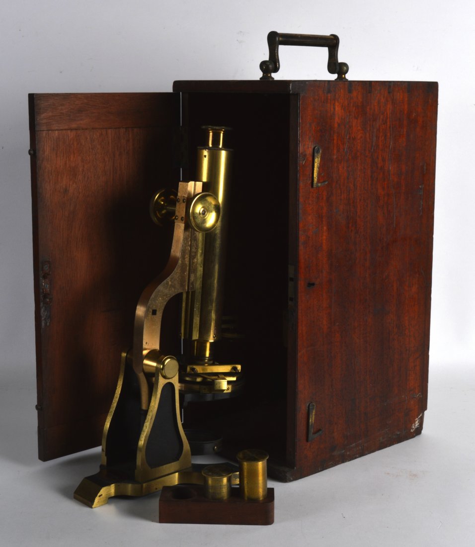 A LATE VICTORIAN W HEATH OPTICAL MICROSCOPE contained: A LATE VICTORIAN W HEATH OPTICAL MICROSCOPE contained within its original fitted box. 1ft 2ins high.