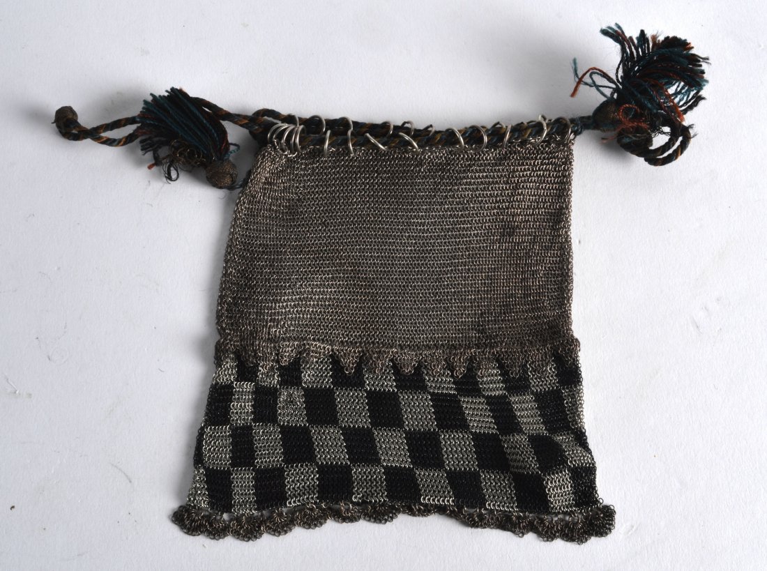 AN 18TH/19TH CENTURY CONTINENTAL SILVER MESH PURSE with: AN 18TH/19TH CENTURY CONTINENTAL SILVER MESH PURSE with beadwork mounts. 4.5ins wide.