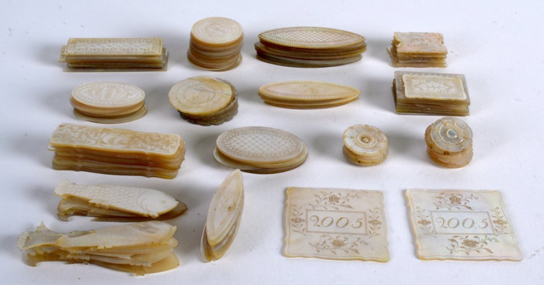 A LARGE COLLECTION OF 19TH CENTURY CHINESE CARVED: A LARGE COLLECTION OF 19TH CENTURY CHINESE CARVED MOTHER OF PEARL GAMING COUNTERS of various forms and sizes. (qty)