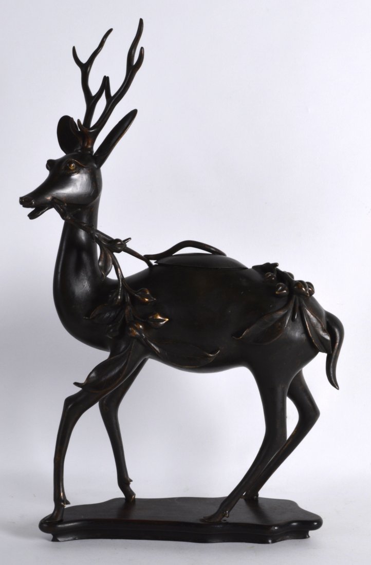 A GOOD 18TH CENTURY CHINESE BRONZE INCENSE BURNER AND: A GOOD 18TH CENTURY CHINESE BRONZE INCENSE BURNER AND COVER in the form of a stag, upon a fitted hardwood base. 1ft 4.5ins high.