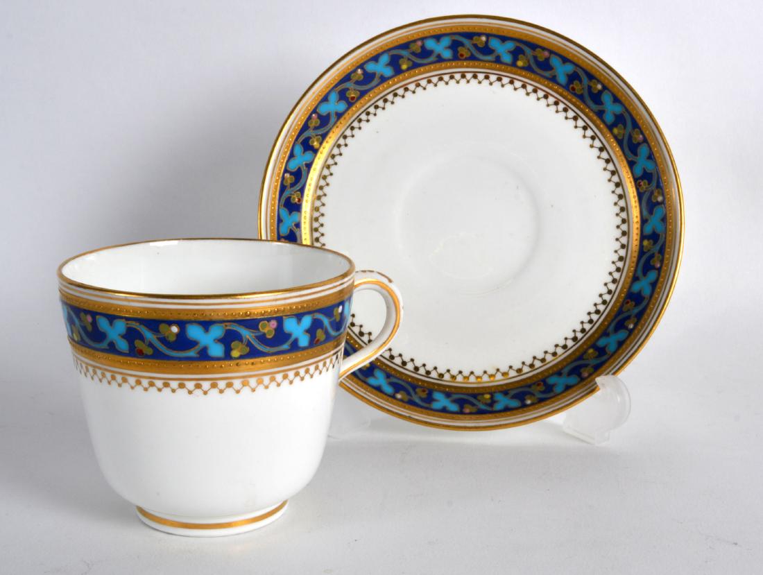 Late 19th c. Minton coffee cup and saucer decorated in: Late 19th c. Minton coffee cup and saucer decorated in Christopher Dresser style with turquoise on blue and coloured raised jewelling.