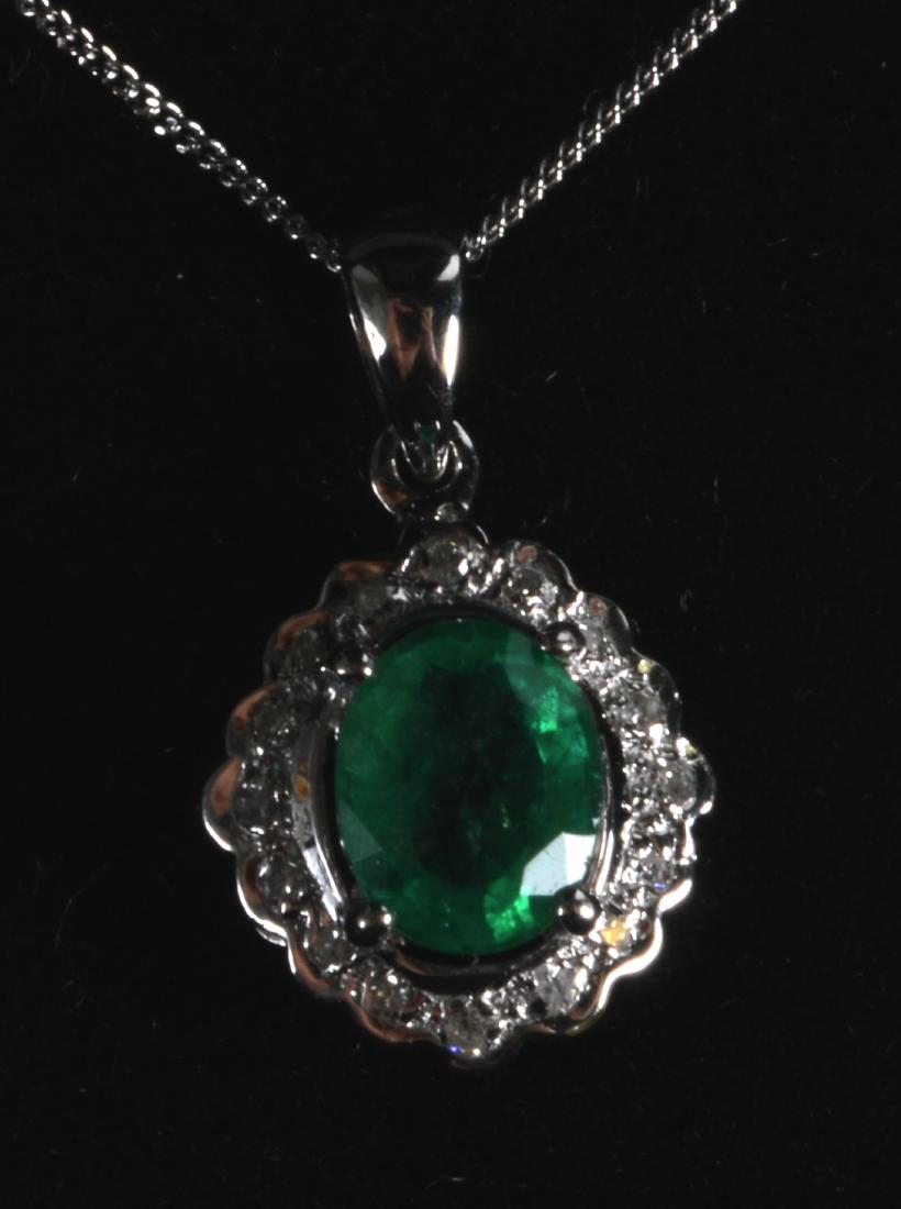 A 9CT GOLD EMERALD AND DIAMOND NECKLACE. (1 of 1)