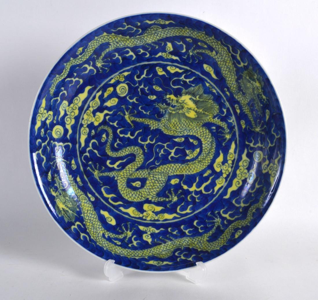 A CHINESE YELLOW AND BLUE GROUND CIRCULAR DISH bearing (1 of 2)