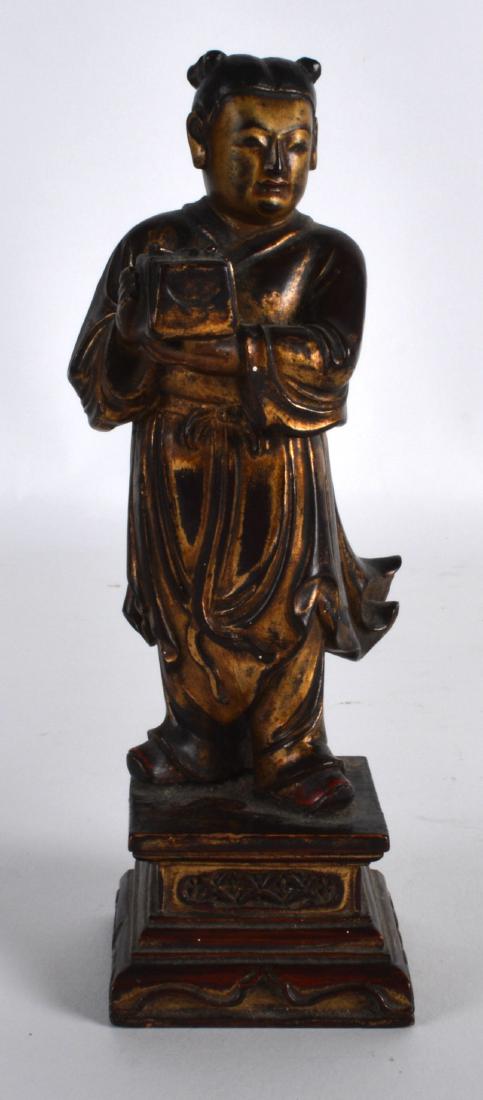 AN 18TH CENTURY CHINESE POLYCHROMED LACQUER FIGURE OF A: AN 18TH CENTURY CHINESE POLYCHROMED LACQUER FIGURE OF A FEMALE modelled standing upon a square form base. 6.25ins high.