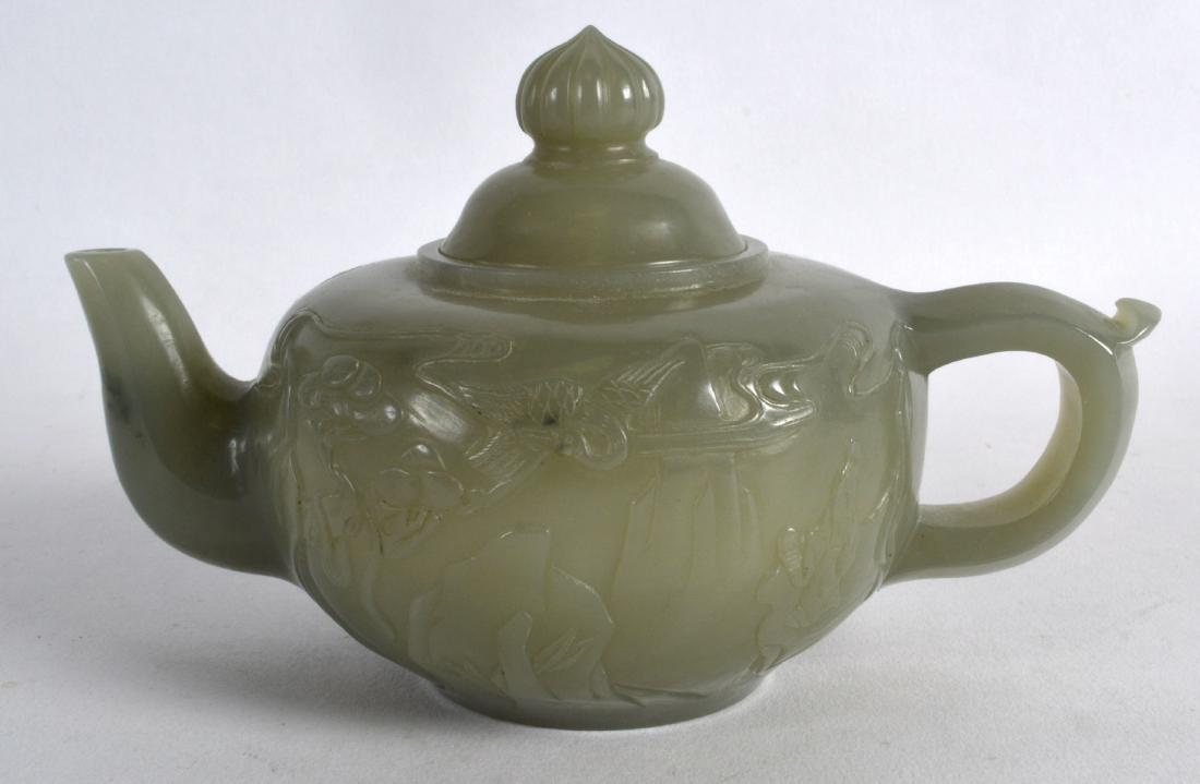 A CHINESE CARVED GREEN JADE TEAPOT AND COVER decorated (1 of 2)