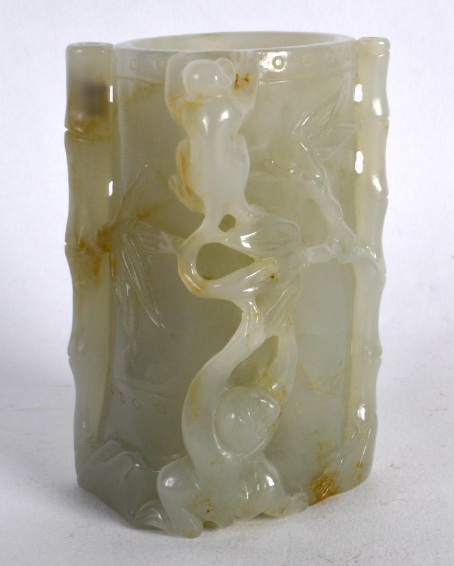 A CHINESE CARVED GREEN JADE BRUSH POT overlaid with (1 of 2)