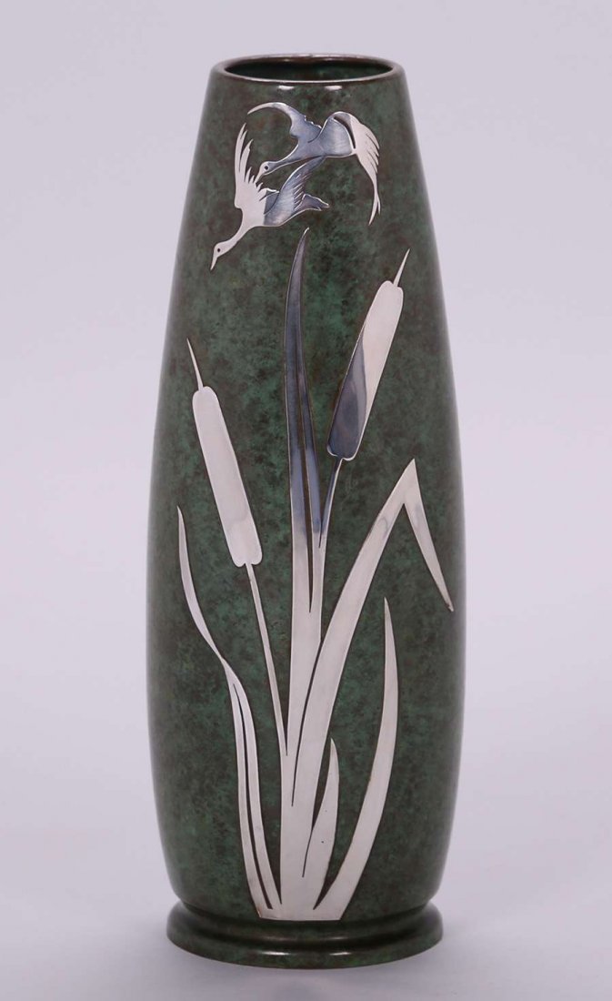 Silvercrest Sterling on Bronze Cattail Vase: Silvercrest sterling on bronze vase with exquisite cattail and bird design. Signed. Excellent original patina. 13″h x 4.25″d. We box and ship ourselves, to keep shipping costs low. We do n
